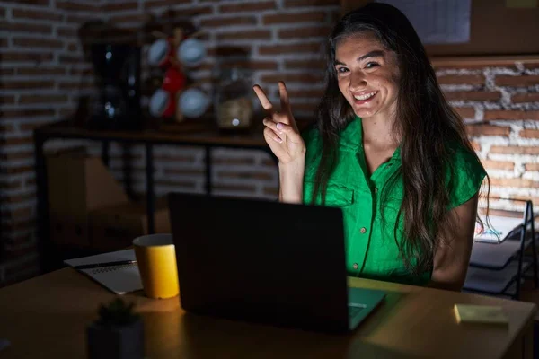 Young Teenager Girl Working Office Night Smiling Happy Face Winking — Stockfoto