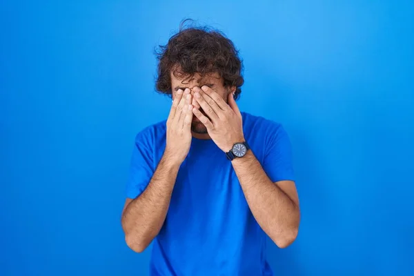 Hispanic Young Man Standing Blue Background Rubbing Eyes Fatigue Headache — Stockfoto