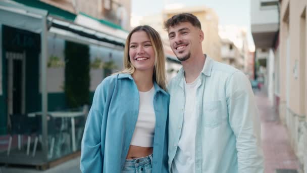 Young Couple Smiling Confident Hugging Each Other Standing Street — Stock Video