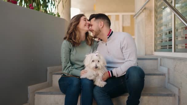 Young Couple Kissing Holding Dog Street — Video Stock