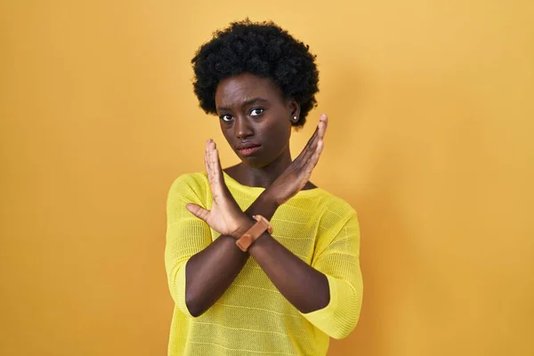 African Young Woman Standing Yellow Studio Rejection Expression Crossing Arms — Stockfoto
