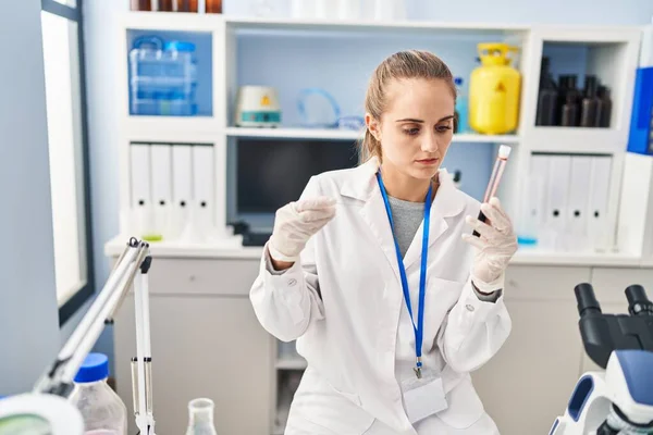 Young Blonde Woman Wearing Scientist Uniform Analysing Blood Laboratory —  Fotos de Stock