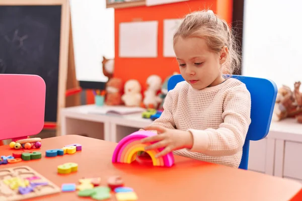 Adorable Blonde Girl Playing Toys Sitting Table Kindergarten — Stockfoto
