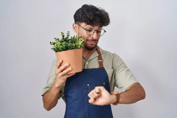 Arab Man Beard Holding Green Plant Pot Looking Watch Time — 图库照片