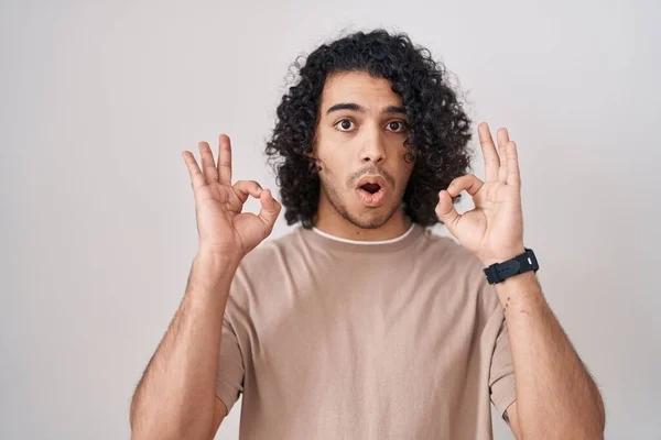 Hispanic Man Curly Hair Standing White Background Looking Surprised Shocked — Photo