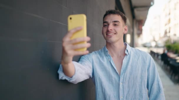 Young Hispanic Man Smiling Confident Making Selfie Smartphone Street — Vídeo de stock