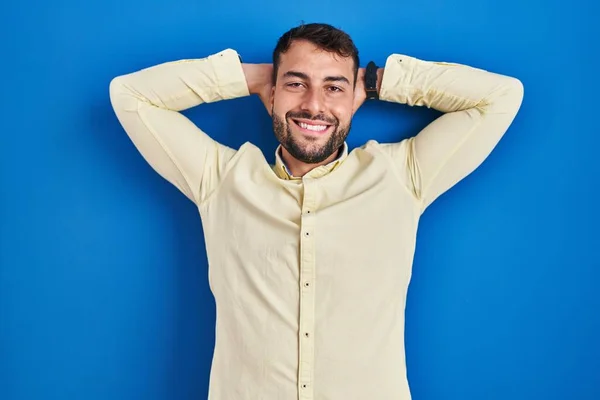 Handsome Hispanic Man Standing Blue Background Relaxing Stretching Arms Hands — Photo