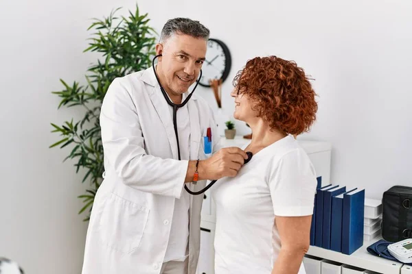 Middle Age Man Woman Wearing Doctor Uniform Auscultate Heart Having — Stock Photo, Image
