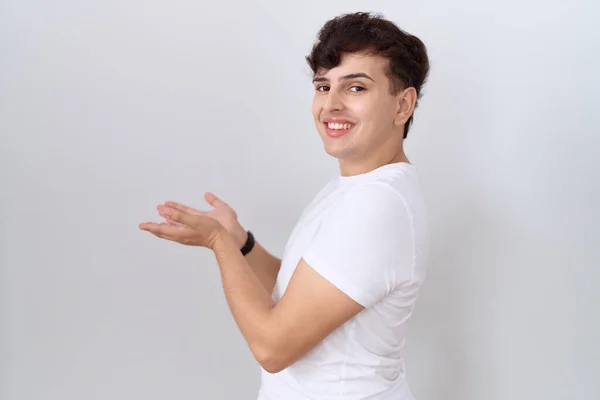 Young Non Binary Man Wearing Casual White Shirt Pointing Aside — Stock Photo, Image
