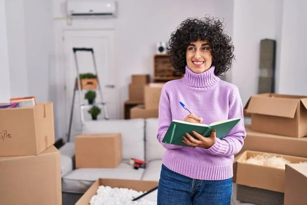 Young Middle East Woman Smiling Confident Writing Notebook New Home — Stock Photo, Image