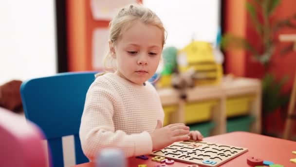 Adorable Blonde Girl Playing Maths Puzzle Game Sitting Table Kindergarten — Vídeo de Stock