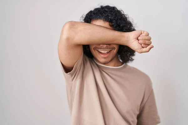 Hispanic Man Curly Hair Standing White Background Covering Eyes Arm — Stock Photo, Image