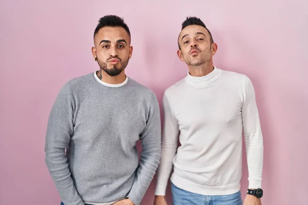 Homosexual Couple Standing Pink Background Looking Camera Blowing Kiss Air — 스톡 사진