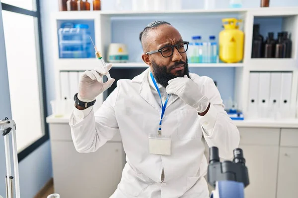 African American Man Working Scientist Laboratory Holding Syringe Serious Face — 图库照片