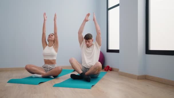Young Couple Smiling Confident Training Yoga Sport Center — Stock Video