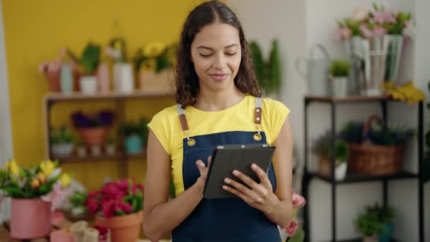 Young African American Woman Florist Smiling Confident Using Touchpad Flower — Wideo stockowe