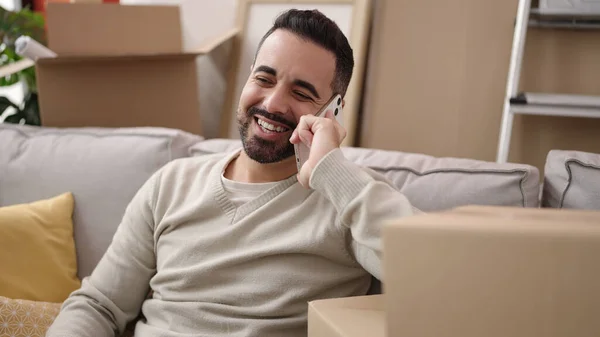 Young Hispanic Man Smiling Confident Talking Smartphone New Home — Stock Fotó