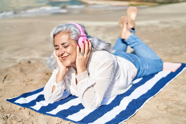 Middle Age Woman Listening Music Lying Towel Seaside —  Fotos de Stock