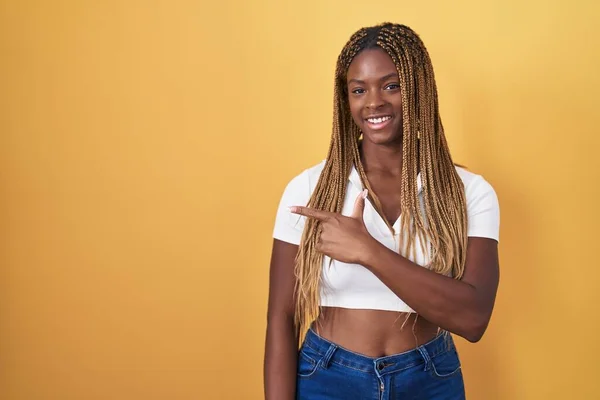 African American Woman Braided Hair Standing Yellow Background Cheerful Smile — Photo