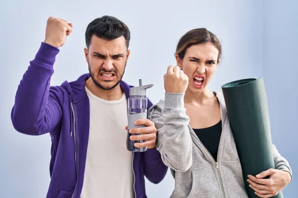 Young Hispanic Couple Wearing Sportswear Annoyed Frustrated Shouting Anger Yelling — Stockfoto