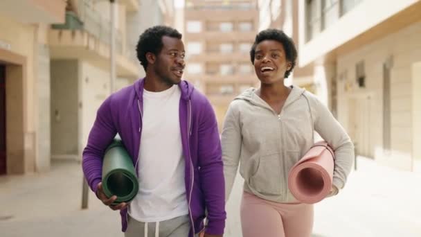 African American Man Woman Couple Holding Yoga Mat Walking Street — Stockvideo