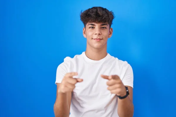Hispanic Teenager Standing Blue Background Pointing Fingers Camera Happy Funny — Foto de Stock