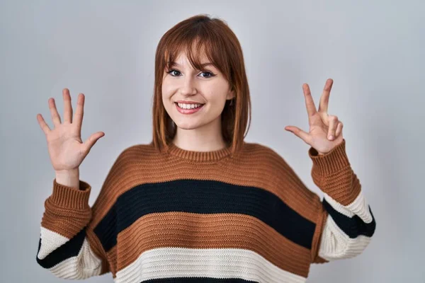 Young Beautiful Woman Wearing Striped Sweater Isolated Background Showing Pointing — 图库照片