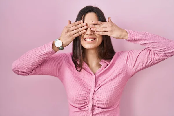 Young Hispanic Woman Standing Pink Background Covering Eyes Hands Smiling — Stok fotoğraf