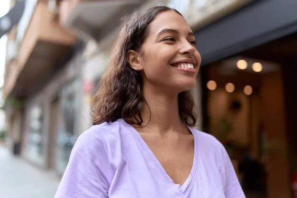 stock image Young african american woman smiling confident looking to the side at street