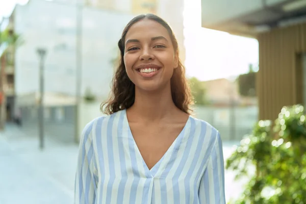 stock image Young african american woman smiling confident standing at coffee shop terrace