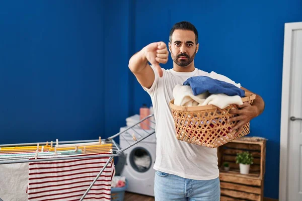 Young Hispanic Man Beard Holding Laundry Basket Angry Face Negative — Stok fotoğraf