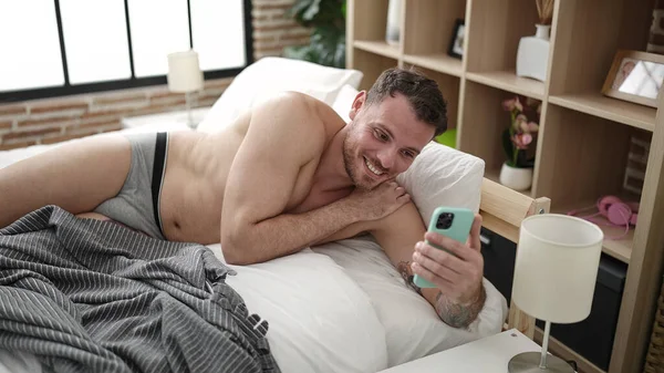 Young Caucasian Man Doing Video Call Smartphone Lying Bed Bedroom — Stock Fotó