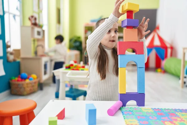 Adorable Hispanic Girl Playing Construction Blocks Sitting Floor Kindergarten — Stockfoto