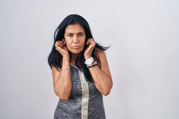 Mature Hispanic Woman Standing White Background Covering Ears Fingers Annoyed — Photo