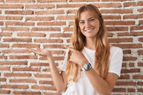 Young Caucasian Woman Standing Bricks Wall Amazed Smiling Camera While — Stock fotografie