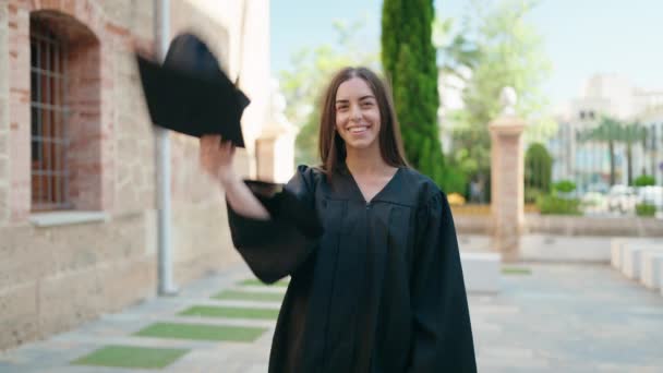 Young Hispanic Woman Smiling Confident Throwing Hat Graduation University — Stockvideo