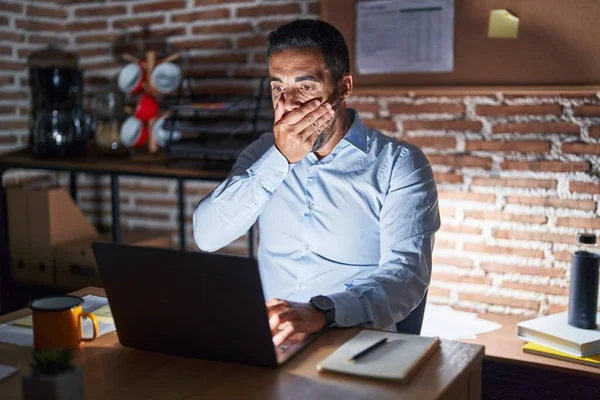 Hispanic Man Beard Working Office Night Shocked Covering Mouth Hands — Stockfoto