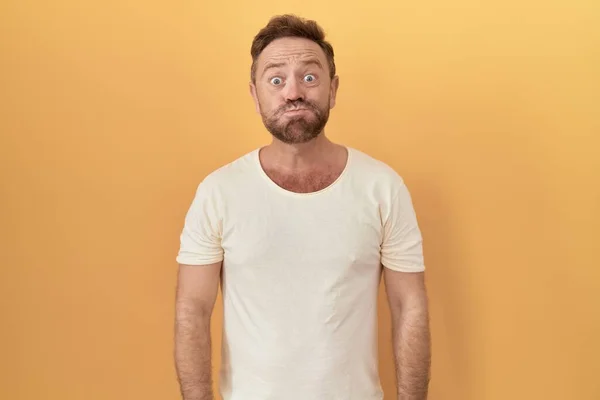 Middle Age Man Beard Standing Yellow Background Puffing Cheeks Funny — Fotografia de Stock