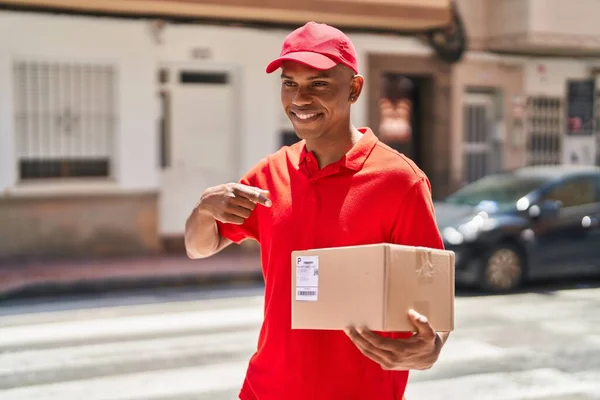 Young Latin Man Delivery Worker Pointing Finger Package Street — Stok fotoğraf