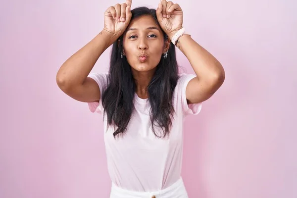 Young Hispanic Woman Standing Pink Background Doing Funny Gesture Finger —  Fotos de Stock