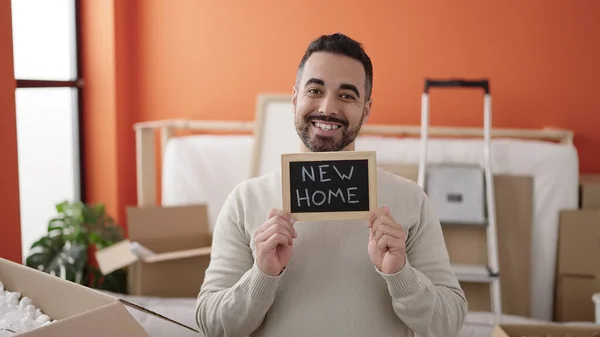 Young Hispanic Man Smiling Confident Holding Blackboard New Home — Stockfoto