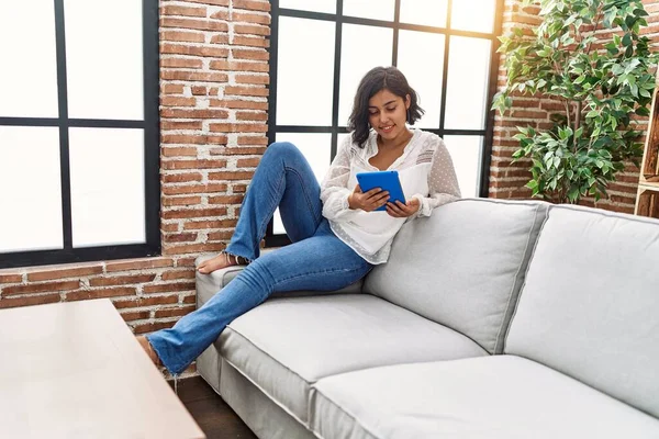 Young Latin Woman Using Touchpad Sitting Sofa Home — Foto Stock