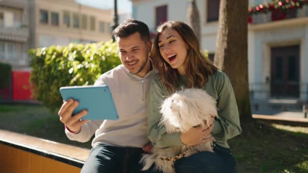 Young Couple Holding Dog Having Video Call Park — Wideo stockowe
