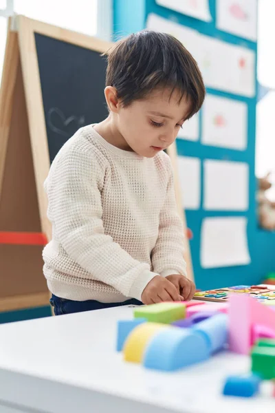 Adorable Hispanic Boy Playing Maths Puzzle Game Standing Kindergarten — Stockfoto