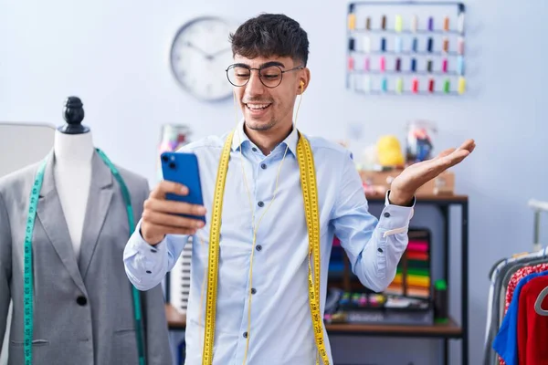 Young Hispanic Man Dressmaker Designer Using Smartphone Celebrating Achievement Happy — Stock Fotó