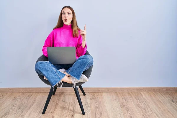 Young Hispanic Girl Working Using Computer Laptop Amazed Surprised Looking — Stock Fotó