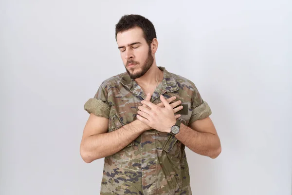 Young Hispanic Man Wearing Camouflage Army Uniform Smiling Hands Chest — Stock Photo, Image