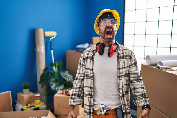 Young Hispanic Man Beard Working Home Renovation Angry Mad Screaming — Stock Photo, Image