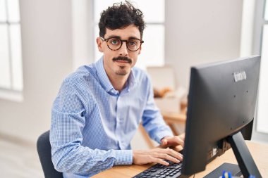 Young caucasian man business worker using computer working at office
