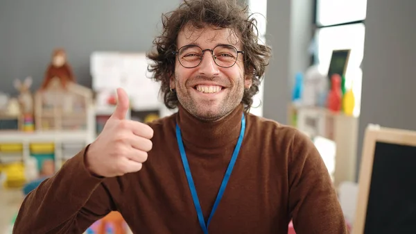 Young Hispanic Man Preschool Teacher Smiling Confident Doing Gesture Kindergarten — Photo